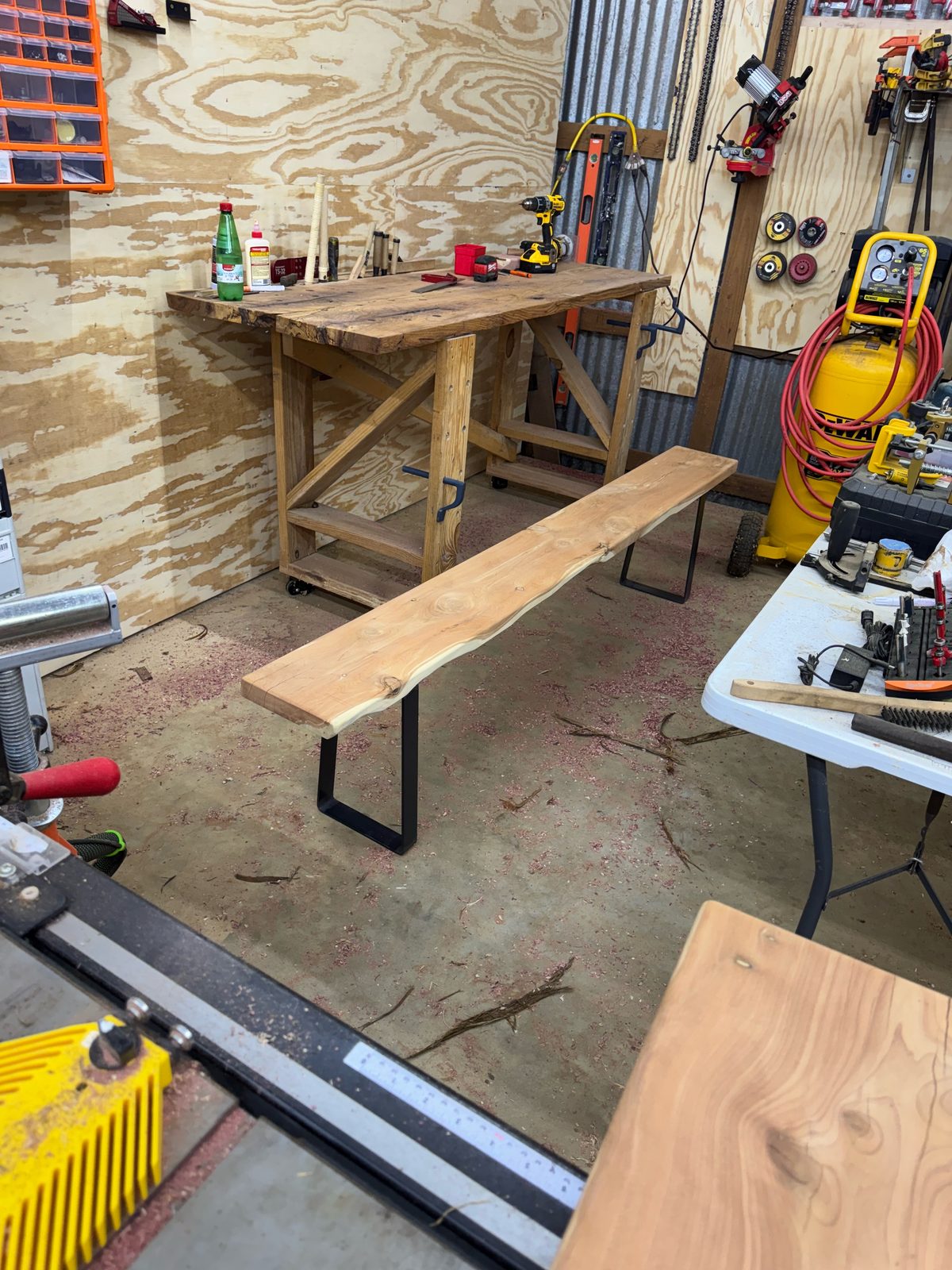 Finished live-edge eastern red cedar bench with black steel legs